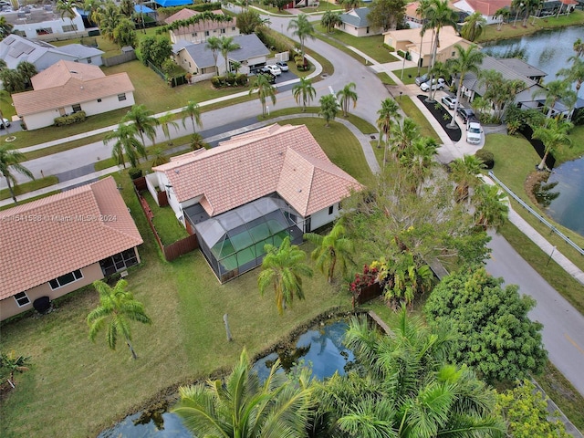 drone / aerial view with a water view