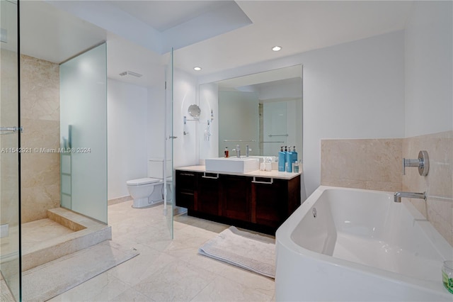 full bathroom featuring shower with separate bathtub, tile floors, oversized vanity, and toilet