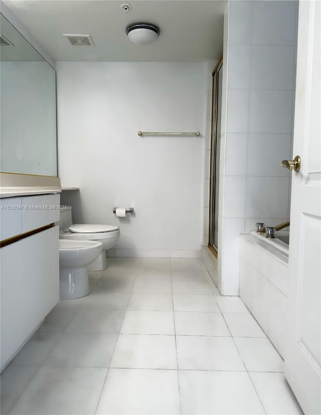 full bathroom with vanity, tile floors, toilet, separate shower and tub, and a bidet