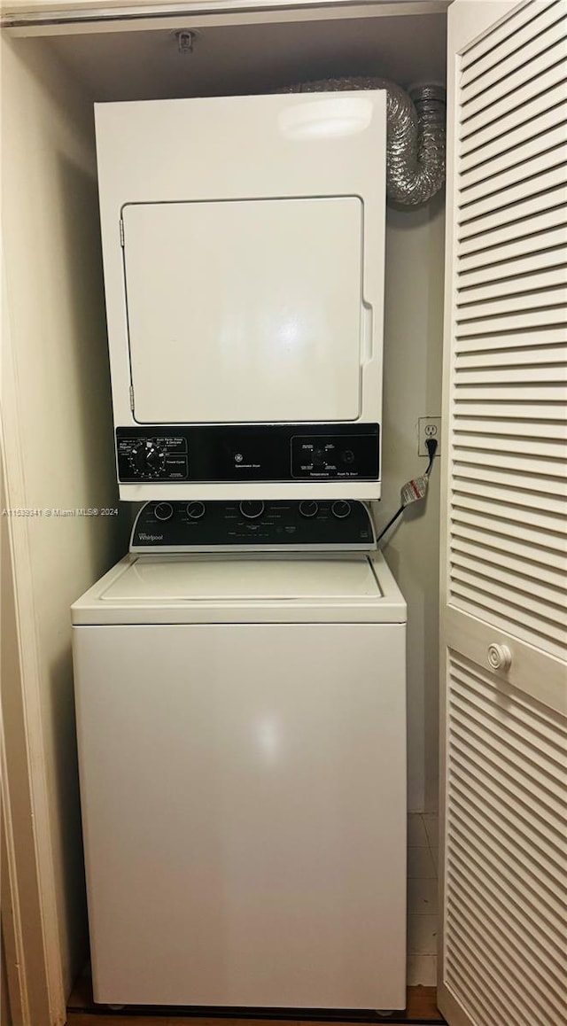 laundry area featuring stacked washer and clothes dryer