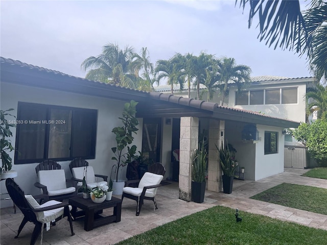 rear view of house with a patio