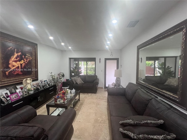 living room featuring light tile floors