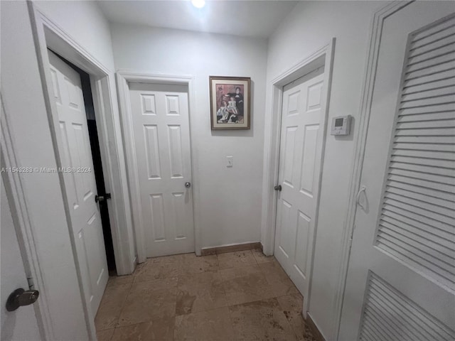 corridor with light tile flooring