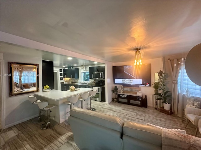 living room with an inviting chandelier