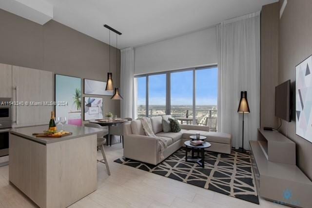 living room featuring a towering ceiling