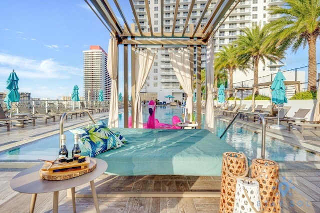 view of swimming pool featuring a pergola