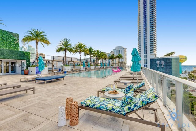 view of swimming pool with a patio area