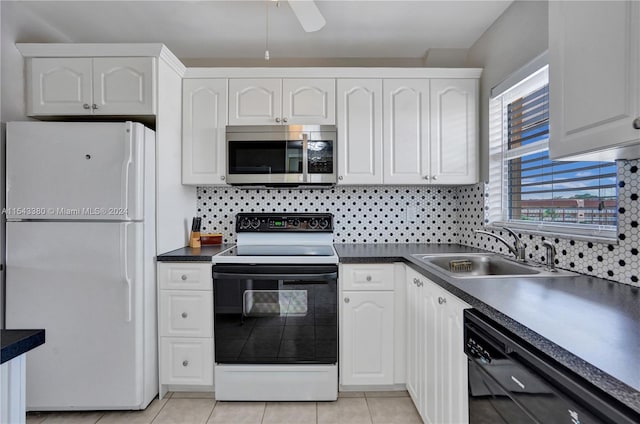 kitchen with black dishwasher, white cabinetry, electric stove, sink, and white refrigerator