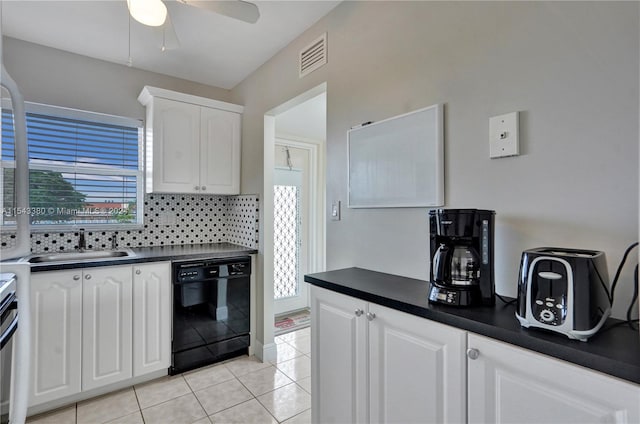 kitchen with light tile patterned flooring, dishwasher, sink, white cabinetry, and decorative backsplash