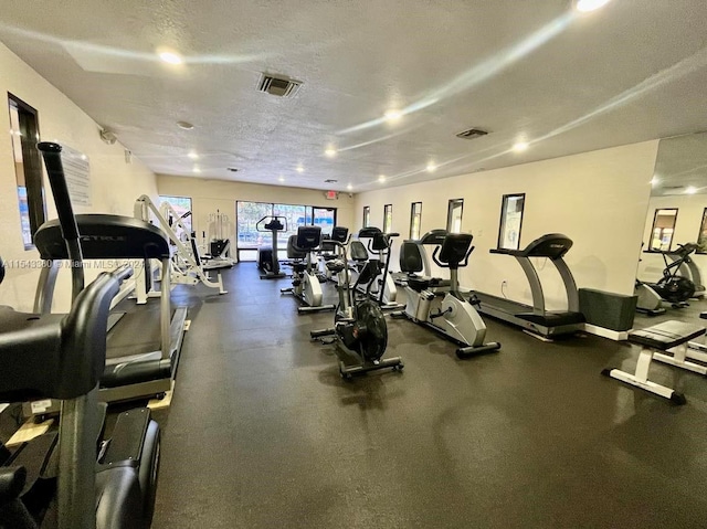 workout area featuring a textured ceiling