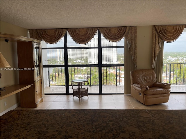 interior space with a textured ceiling and light tile floors