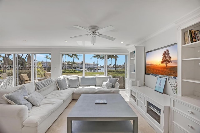 living room with built in features, ornamental molding, and ceiling fan