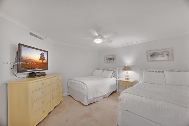 bedroom with crown molding, light colored carpet, and ceiling fan