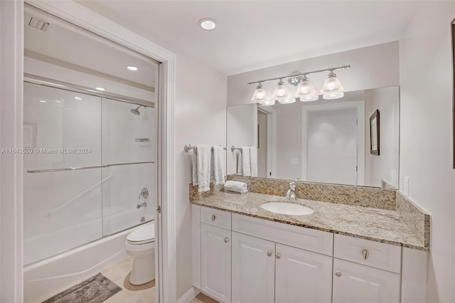 full bathroom with toilet, combined bath / shower with glass door, tile floors, and vanity