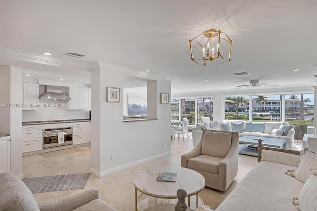 tiled living room featuring ornamental molding and ceiling fan with notable chandelier