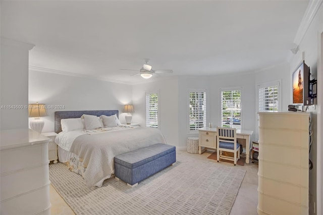 bedroom with ornamental molding and ceiling fan