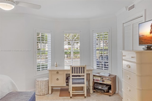 office featuring a healthy amount of sunlight, light tile floors, ceiling fan, and crown molding