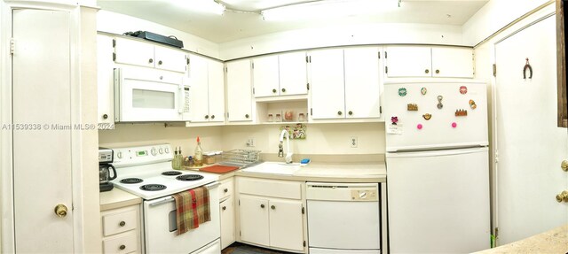 kitchen featuring white cabinets, track lighting, white appliances, and sink