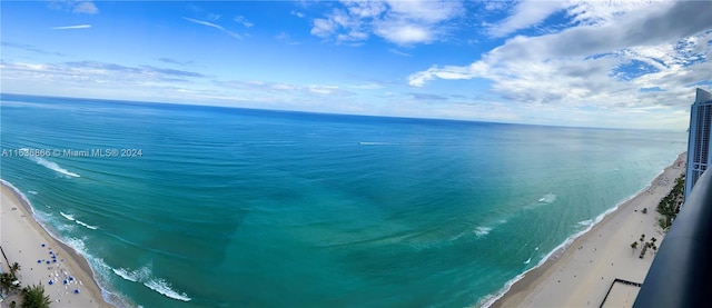 exterior space with a water view and a view of the beach