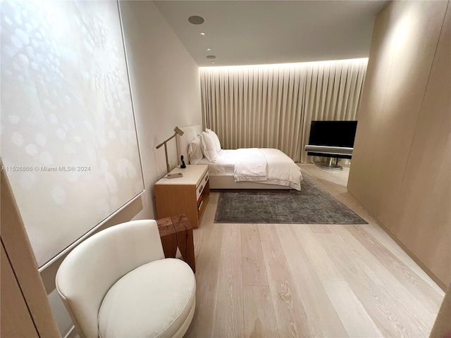 bedroom with light hardwood / wood-style flooring