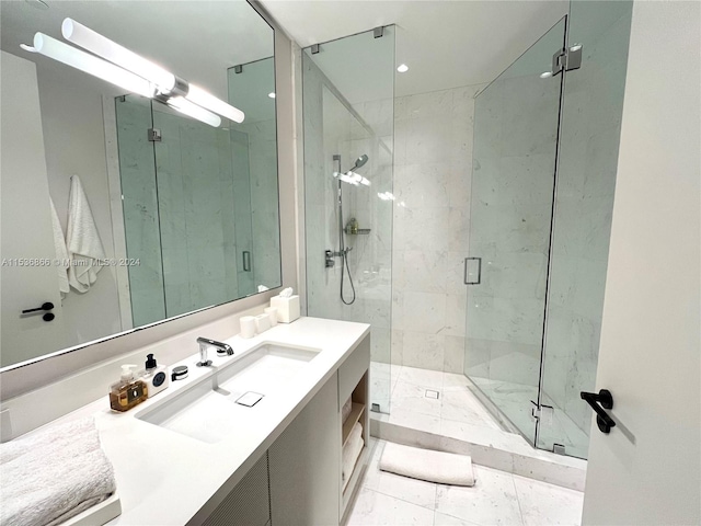 bathroom with vanity, tile flooring, and a shower with shower door