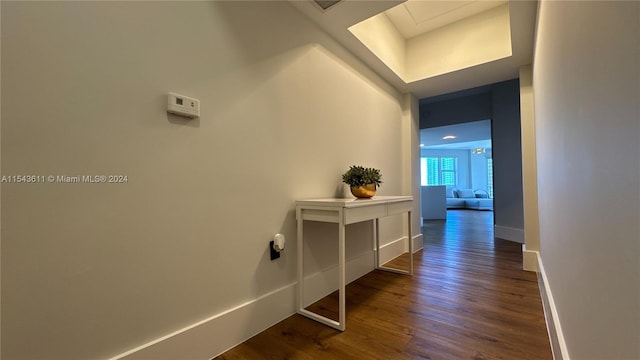 corridor featuring dark wood-type flooring