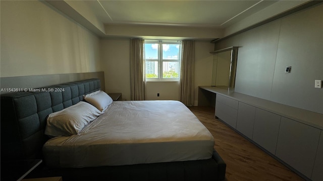 bedroom featuring dark hardwood / wood-style floors