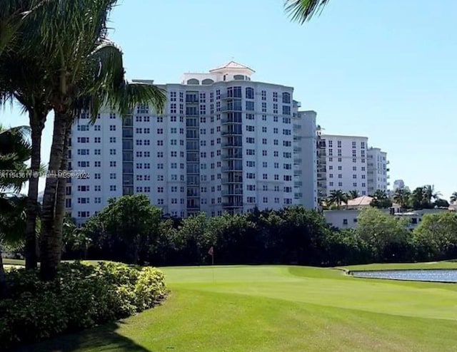 surrounding community featuring a lawn