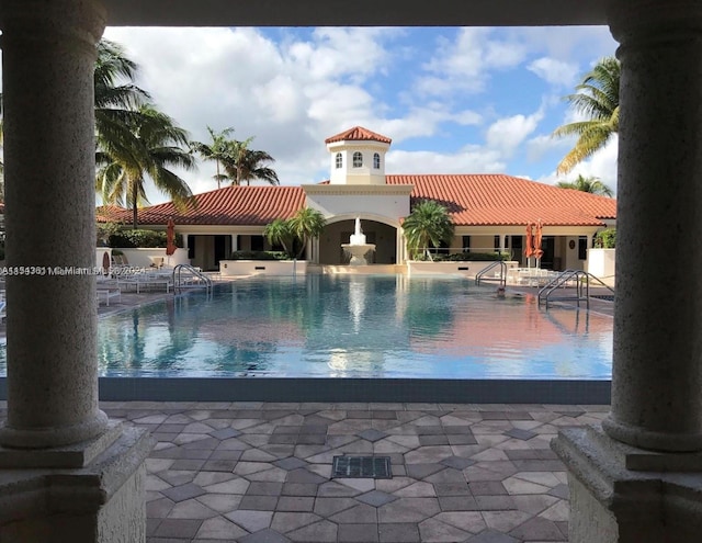 view of swimming pool featuring a patio area