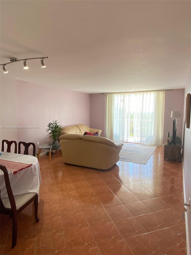 bedroom with tile floors and track lighting