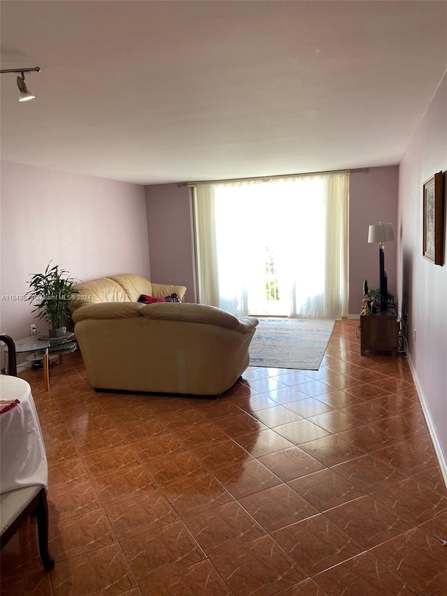 tiled living room with rail lighting