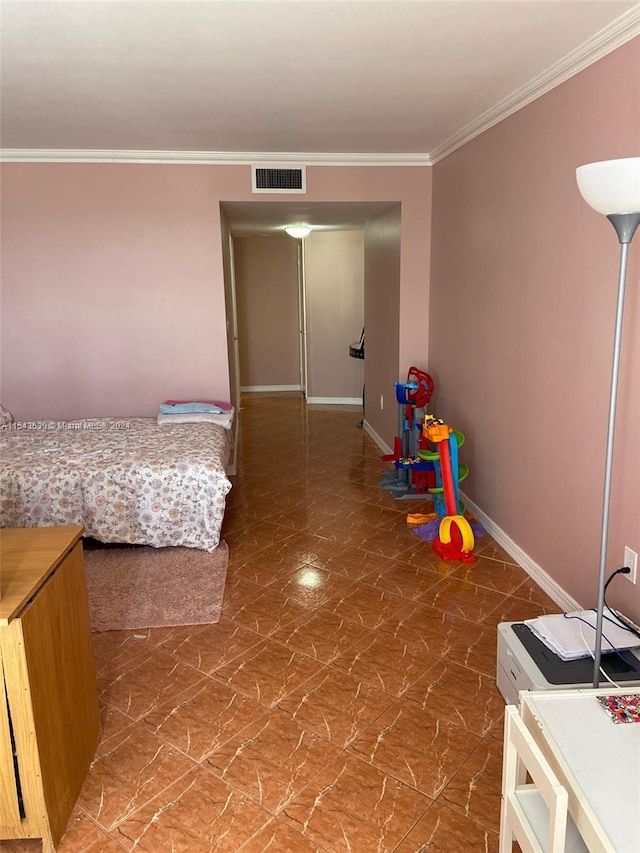 bedroom with ornamental molding and tile floors