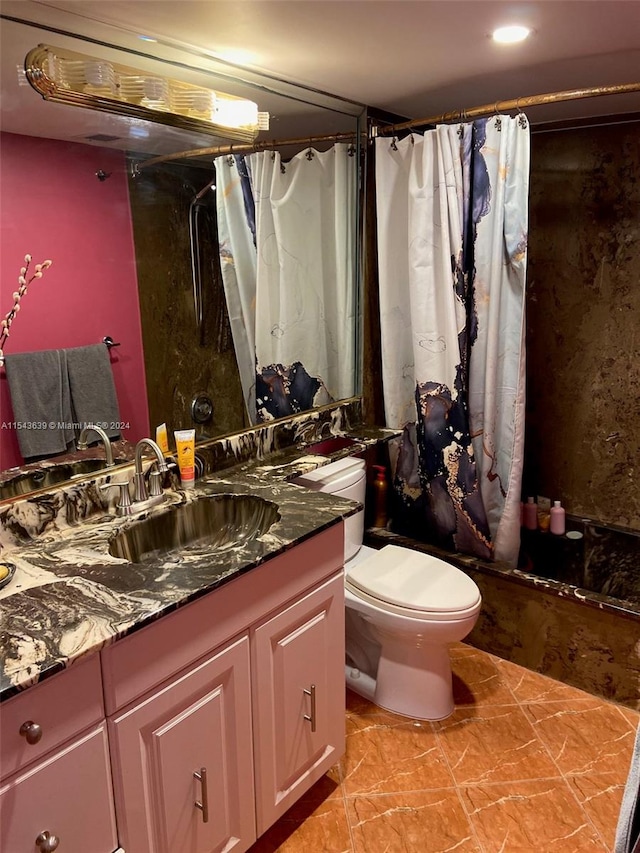 full bathroom with vanity, tile floors, toilet, and shower / bath combination with curtain