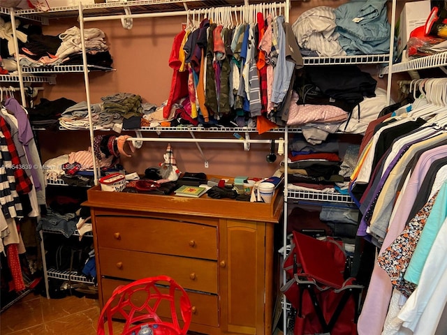 spacious closet featuring tile floors