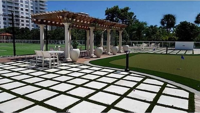 view of property's community with a patio area and a pergola