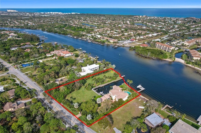 birds eye view of property with a water view