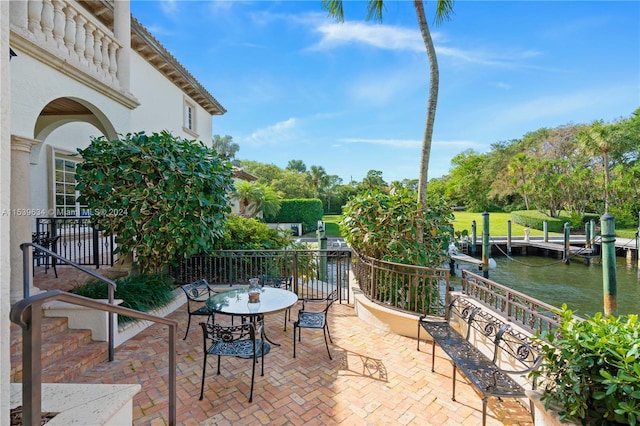 view of patio featuring a water view