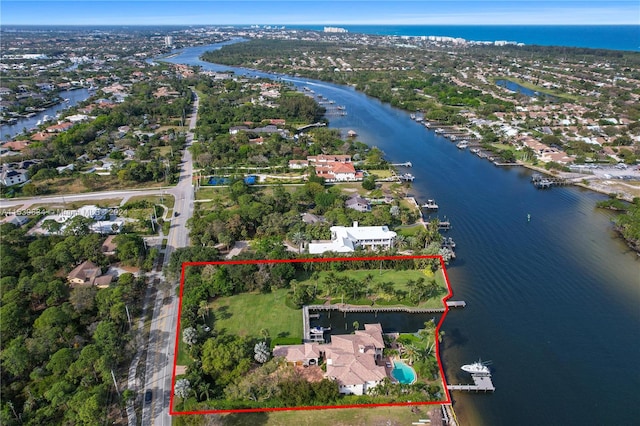 birds eye view of property with a water view