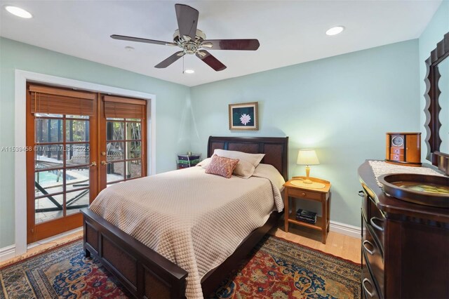 bedroom featuring hardwood / wood-style floors, ceiling fan, and french doors