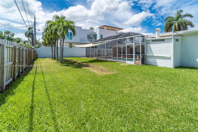 view of yard featuring a lanai and a fenced in pool