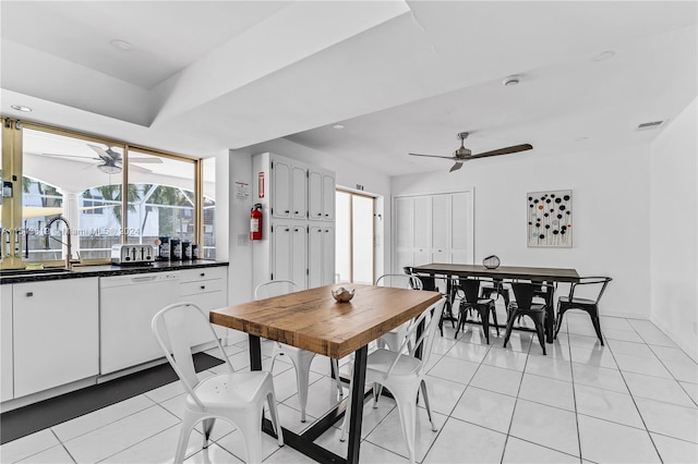 dining room featuring ceiling fan and light tile floors