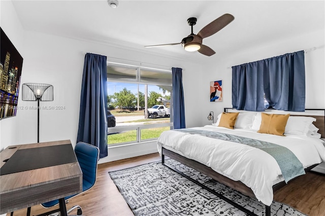 bedroom featuring ceiling fan and hardwood / wood-style flooring