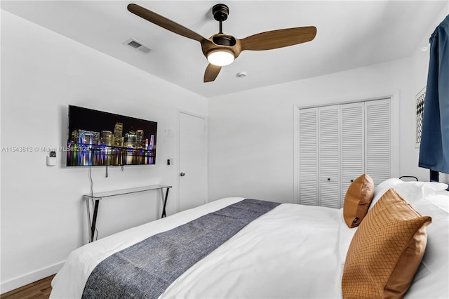 bedroom with a closet, ceiling fan, and hardwood / wood-style flooring