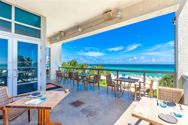 balcony featuring a water view