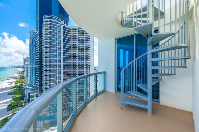 balcony featuring a water view