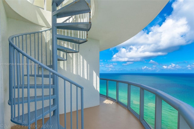 balcony featuring a water view