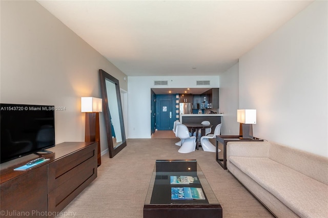 living room featuring light carpet