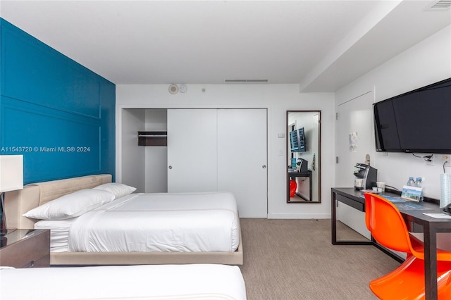 carpeted bedroom featuring a closet