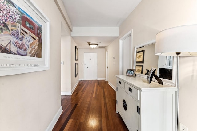 corridor featuring dark hardwood / wood-style flooring