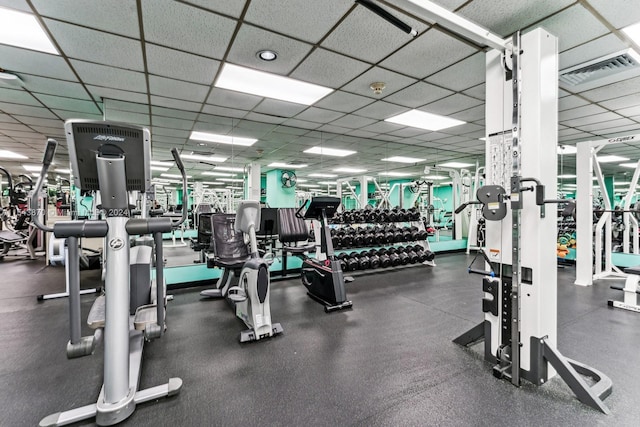 gym featuring a paneled ceiling